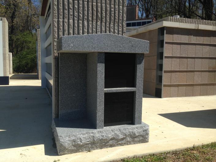 This granite mausoleum comes with a touch of black marble perfect for custom engraving. 